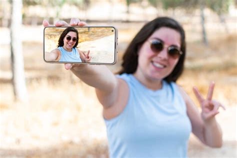 Premium Photo | Caucasian student taking selfie portrait in forest