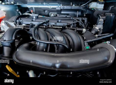 New car engine. Car hood open. Automotive industry Stock Photo - Alamy