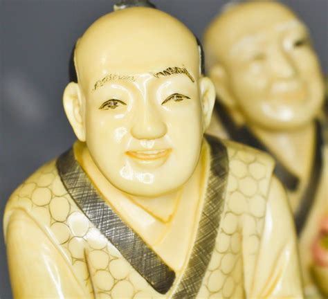 Antique Chinese pair of polychrome ivory figurines