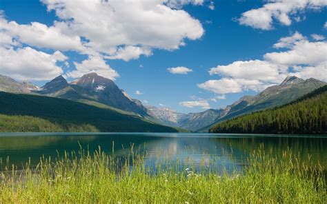 Fluffy white clouds in the blue sky above the mountain lake wallpaper ...