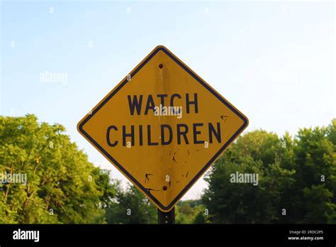 Watch children yellow sign Stock Photo - Alamy