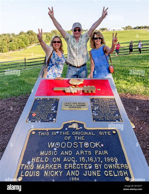 People at The Memorial Stone at The Site of The Woodstock Festival At Bethel Woods New York ...