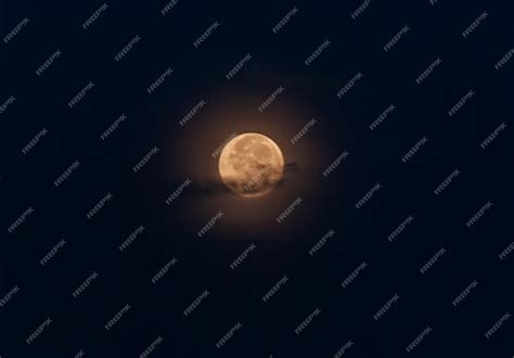 Premium Photo | Full moon in black background