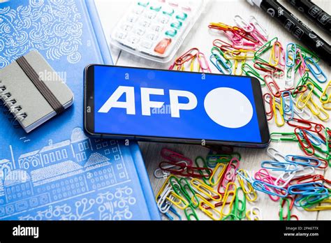 In this photo illustration an AFP Agence France Presse logo seen ...