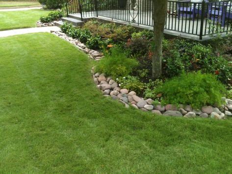 Rock Flower Bed Borders | Landscaping with rocks, River rock garden, Stone flower beds