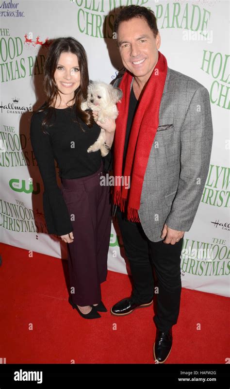 Mark Steines and Julie Freyermuth arrives at the 85th Annual Hollywood Christmas Parade in ...