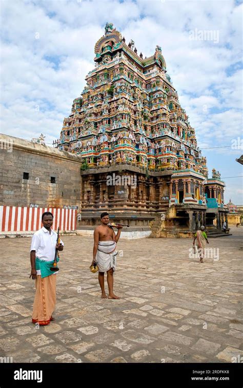 Temple musician with priest, Virudhagireeswarar Shiva temple in Virudhachalam, Tamil Nadu, South ...