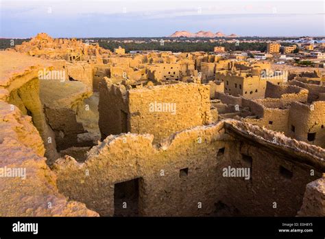 Overview of the remains of Shali fort and village at sunset. Siwa oasis ...