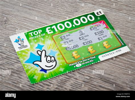 A National Lottery Scratchcard with a £5 win Stock Photo - Alamy