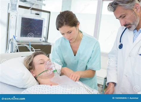 Patient Wearing Oxygen Mask Lying on Bed in Hospital Stock Photo ...