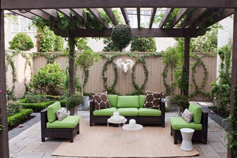 transitional patio with dark toned wood pergola modern green black ...