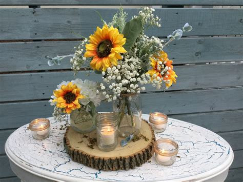 Sunflowers centerpiece | Rustic wedding centerpieces, Sunflower centerpieces, Sunflower themed ...