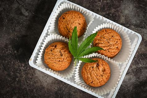 Cannabis food cookies box with cannabis leaf marijuana herb on dark ...