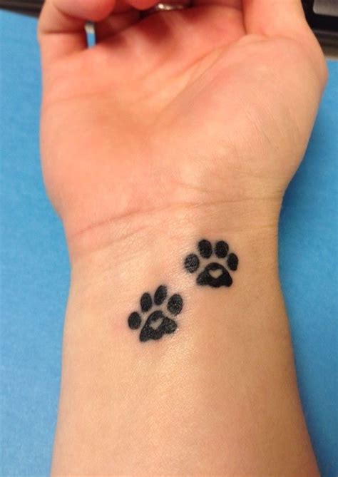 Lovely Black Dog Paw Print Tattoo Tattoo Design March 2016 | Neck tattoo, Tattoos for women ...