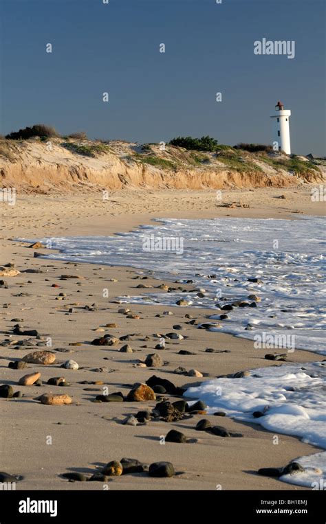 milnerton lighthouse and beach at dusk cape town south africa Stock Photo - Alamy