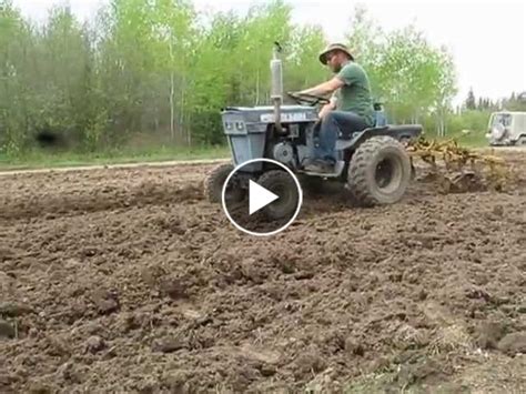 planting potatoes with my 140 ford garden tractor