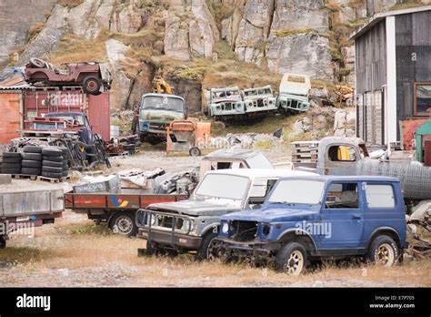 Old discarded wrecked cars in greenland with army jeeps Stock Photo ...