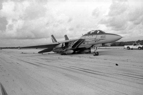 F-14 Tomcat Navy fighter on NAS Key West runway 3 with collapsed main landing gear and blown ...