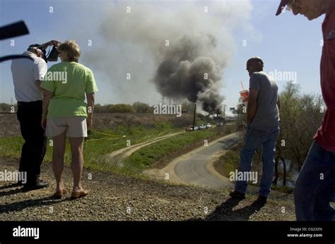 Spectators continued their pilgrimage the train trestle fire on Friday ...