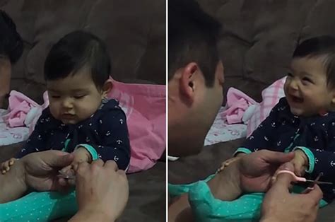 Watch This Baby Adorably Prank Her Dad By Fake Crying As He Tries To Cut Her Nails