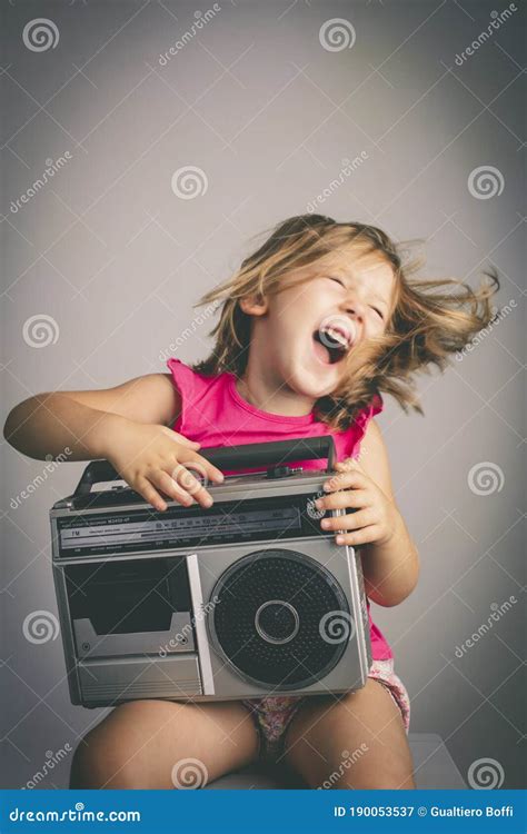 Little Girl Has Fun Listening To Music Stock Image - Image of radio ...