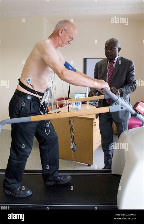 Heart fitness test. Patient using a treadmill as part of a heart fitness test Stock Photo - Alamy