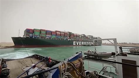 Grounded Mega Ship in Suez Canal Paralyzes Trade for Second Day