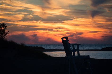 Beach Chair Sunset Photograph by Maria Pickard - Pixels