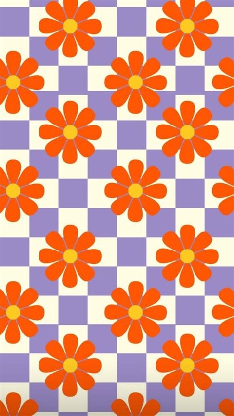 an orange and purple flower pattern on a checkerboard tablecloth ...