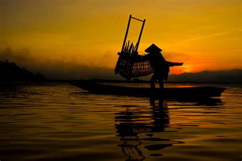 The fishing boats on the Mekong River Thailand Photograph by Somchai Sanvongchaiya | Fine Art ...