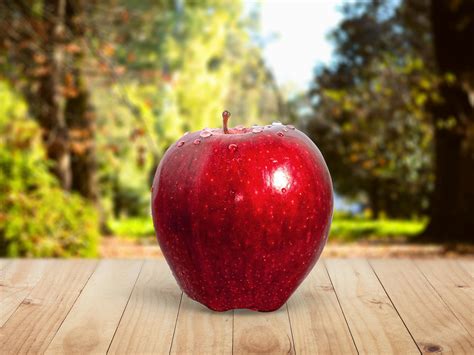 Red Apple Placed on Table · Free Stock Photo