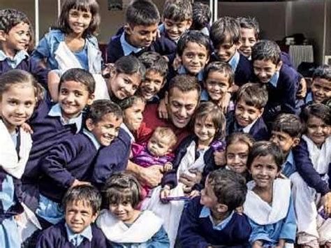 Salman Khan is all smiles posing with a bunch of school kids on the film sets