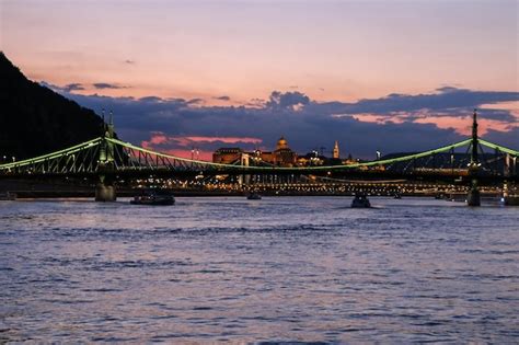 Premium Photo | Evening view of the danube river, bridges, sights of ...