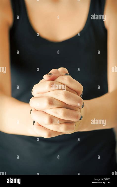 Hands of christian woman praying Stock Photo - Alamy