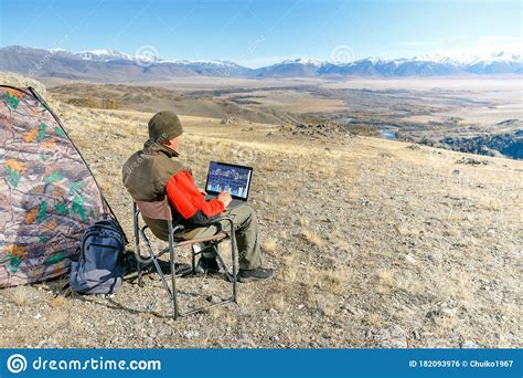 Man Using a Laptop in the Mountain. Senior Man Working on His Laptop Outdoors Stock Photo ...