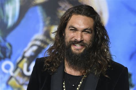 Jason Momoa shaves signature beard to promote recycling | AP News