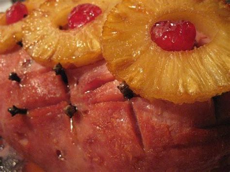 Baked Ham with pineapple, cloves and cherries. This is the way my Grandmother did it. My husband ...