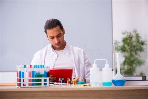 Young Male Chemistry Teacher in the Classroom Stock Image - Image of discovery, research: 204038407