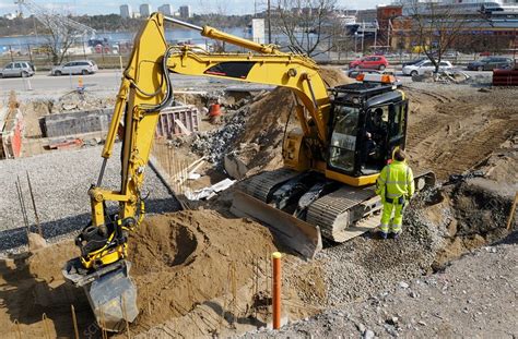 Digger on construction site - Stock Image - F018/5226 - Science Photo Library