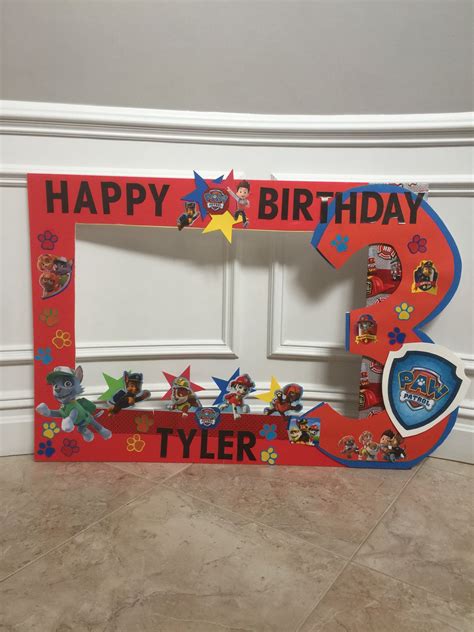 a birthday photo frame with cartoon characters on it