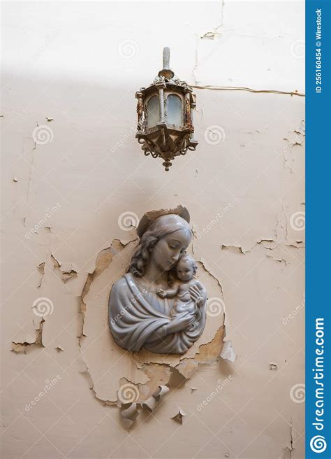 Vertical Shot of a Statue of the Virgin Mary with Baby Jesus Attached ...