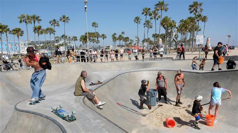 Skateboarders remove sand from iconic Venice Beach skate park despite ...