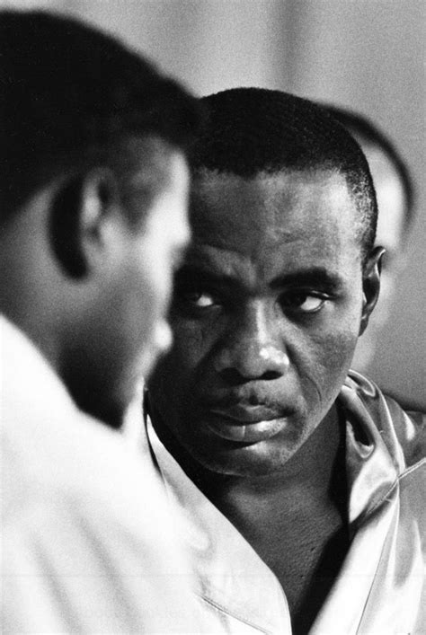 Heavyweight champ Sonny Liston glares at Floyd Patterson during the ...