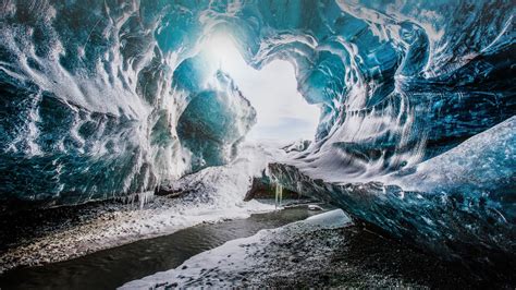 The entrance of the Crystal Cave in Vatnajökull National park, Iceland ...