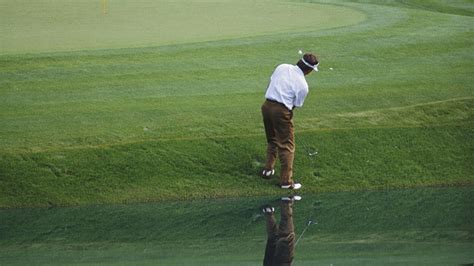 Fred Couples chips to No. 12 green after his ball stayed out of the ...