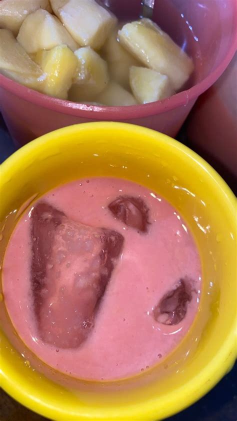 two yellow bowls filled with food next to each other