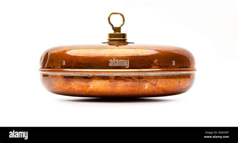 Old antique copper hot water bottle Stock Photo - Alamy