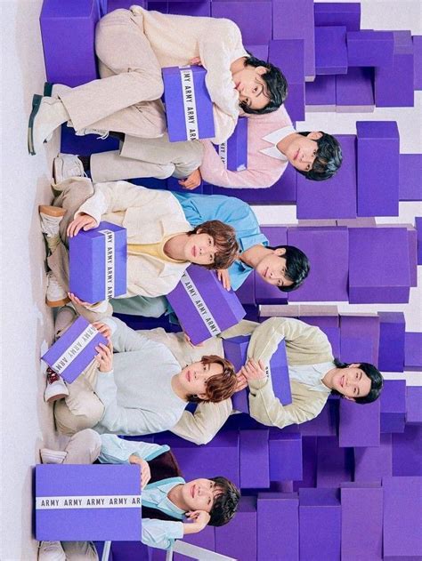 four people holding purple boxes in front of them