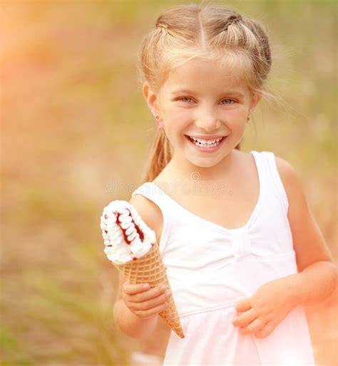 Little girl with ice-cream stock photo. Image of outdoors - 38371126