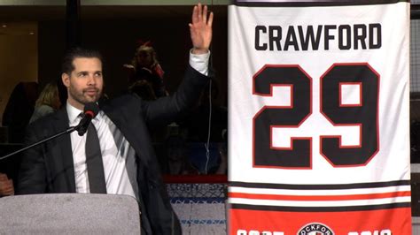 A sold-out Rockford IceHogs crowd welcomes back Corey Crawford; jersey ...